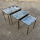 Ensemble de 3 tables gigognes en laiton doré et plateau en verre eglomisé.