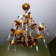 Lustre 4 feux italien en métal doré décoré de pampilles en cristal