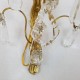Paire d’appliques en bronze doré à pampilles de cristal