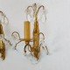 Paire d’appliques en bronze doré à pampilles de cristal