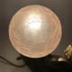 Lampe femme tenant un globe en verre Sujet en régule Art Deco